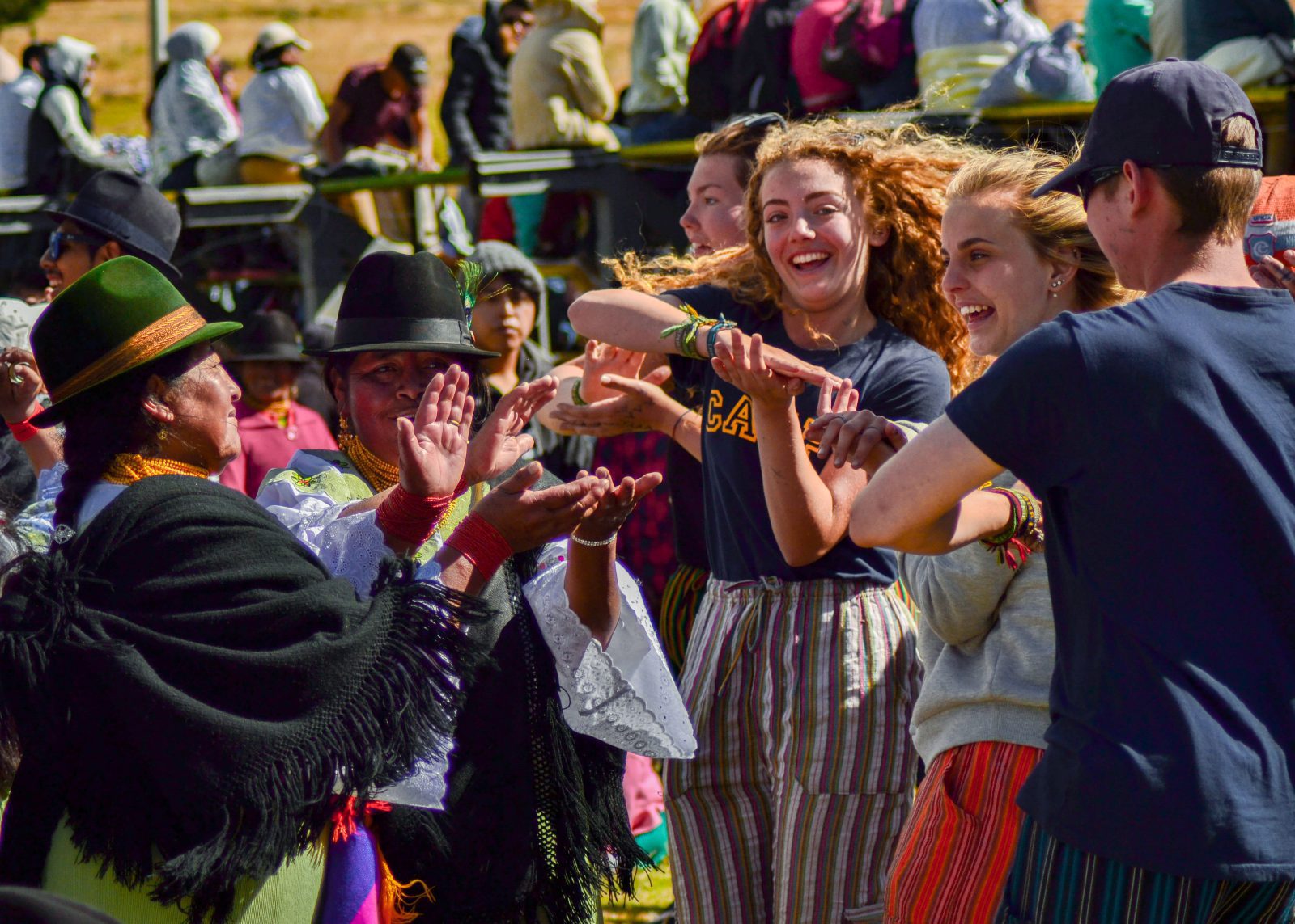 camps_international_local_people_dancing_about_us