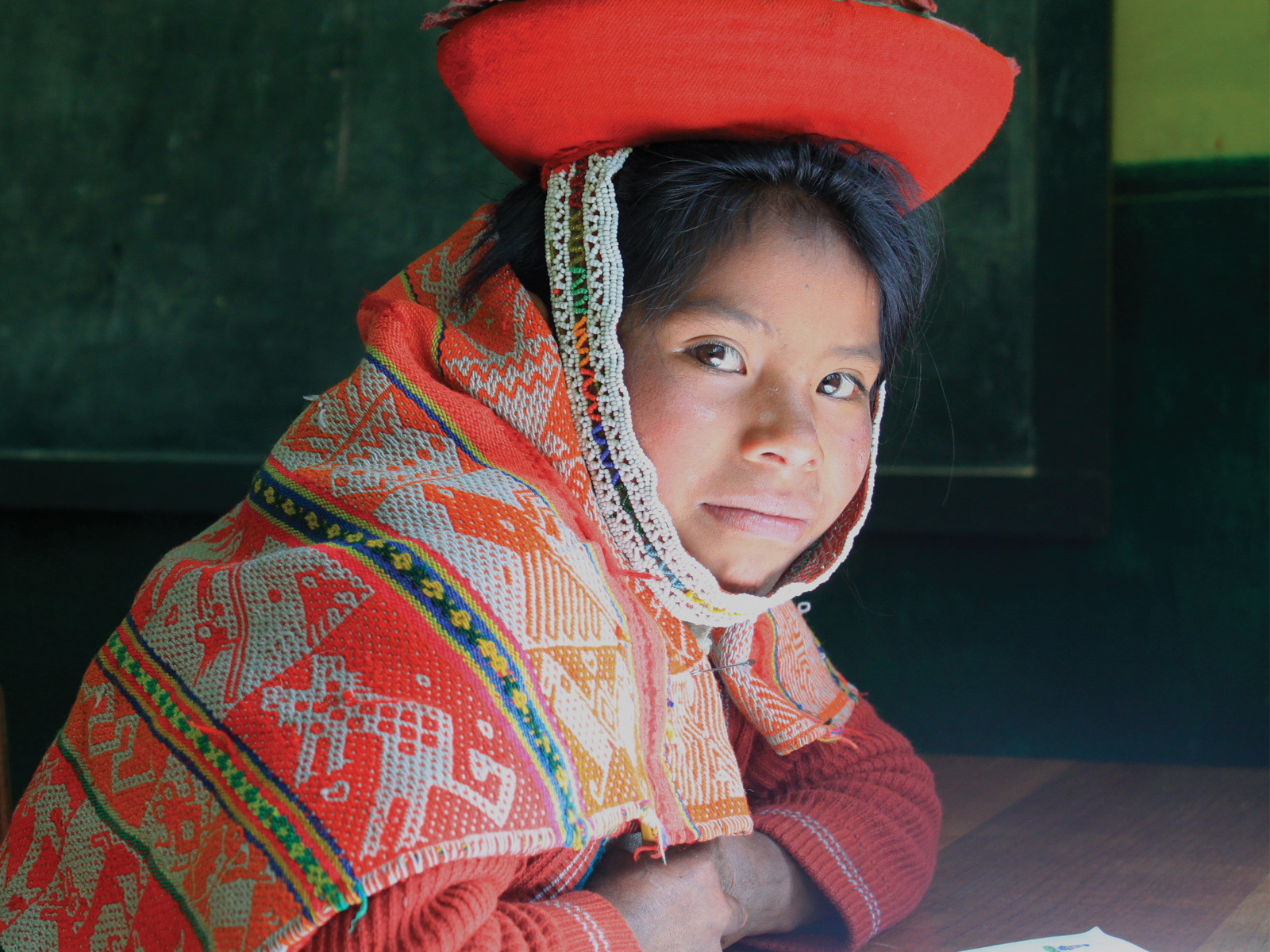 local Peruvian girl dressed in traditional wear