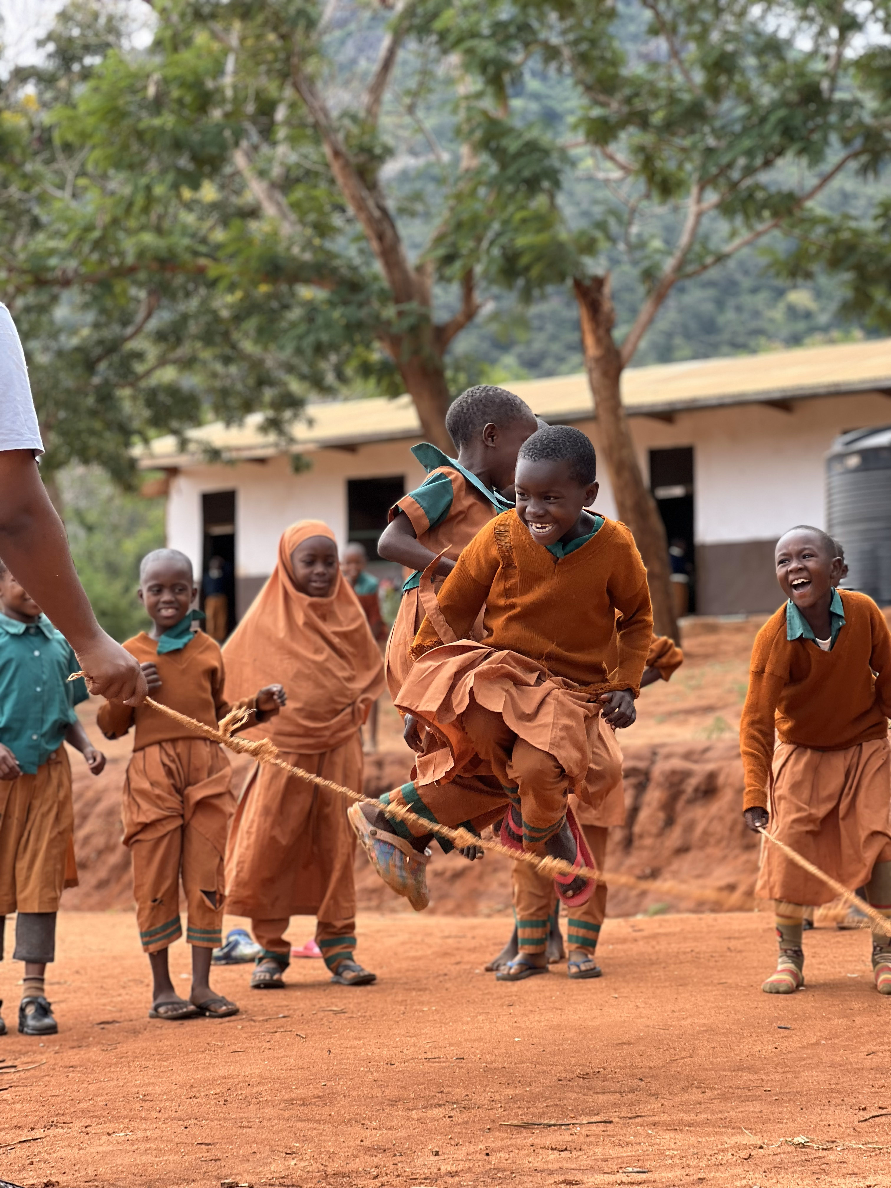 School children in Kenya skipping - Camps International