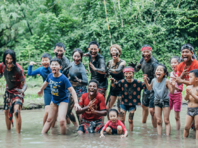 Local community playing in the water at Green camp.
