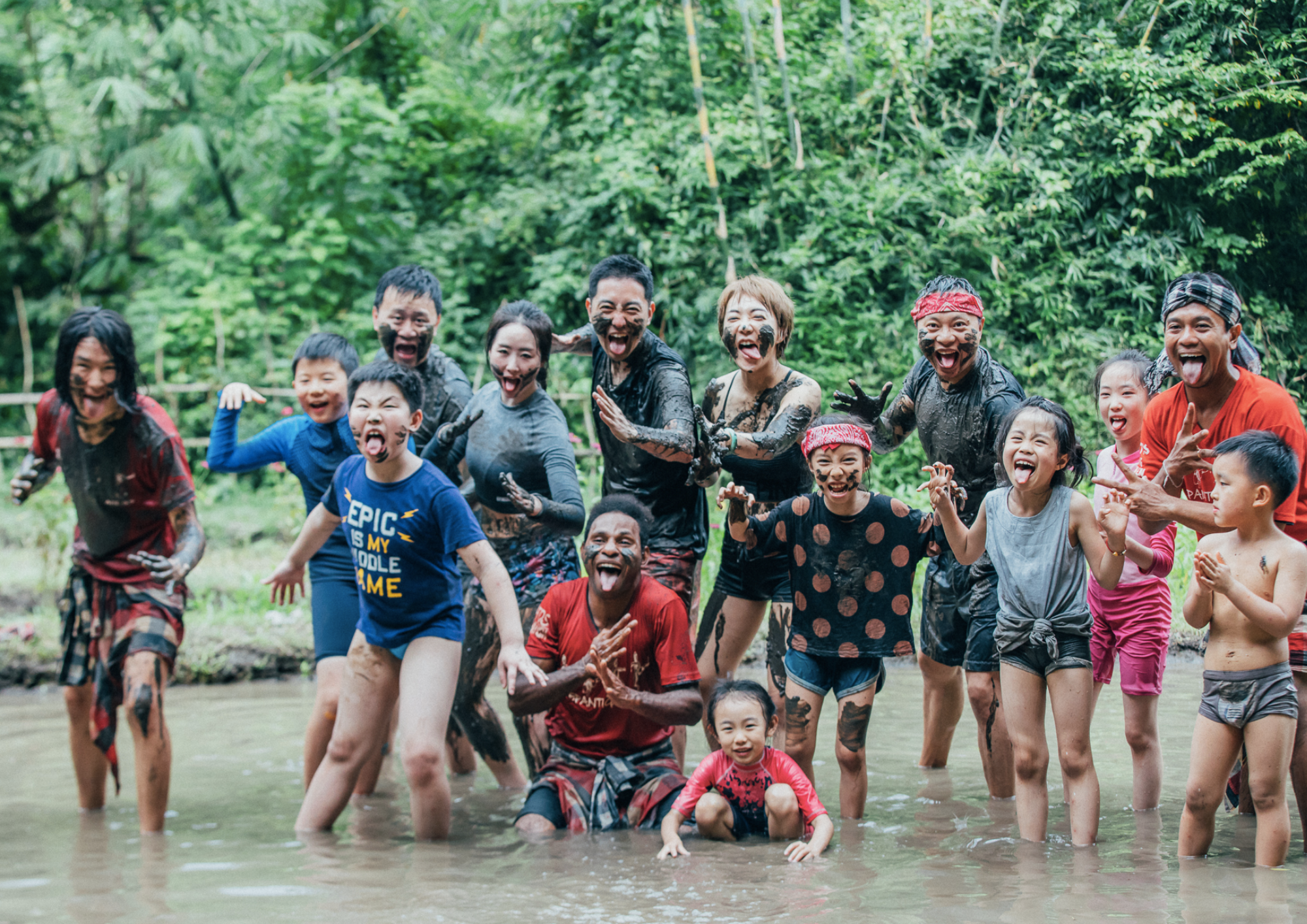 Local community playing in the water at Green camp.