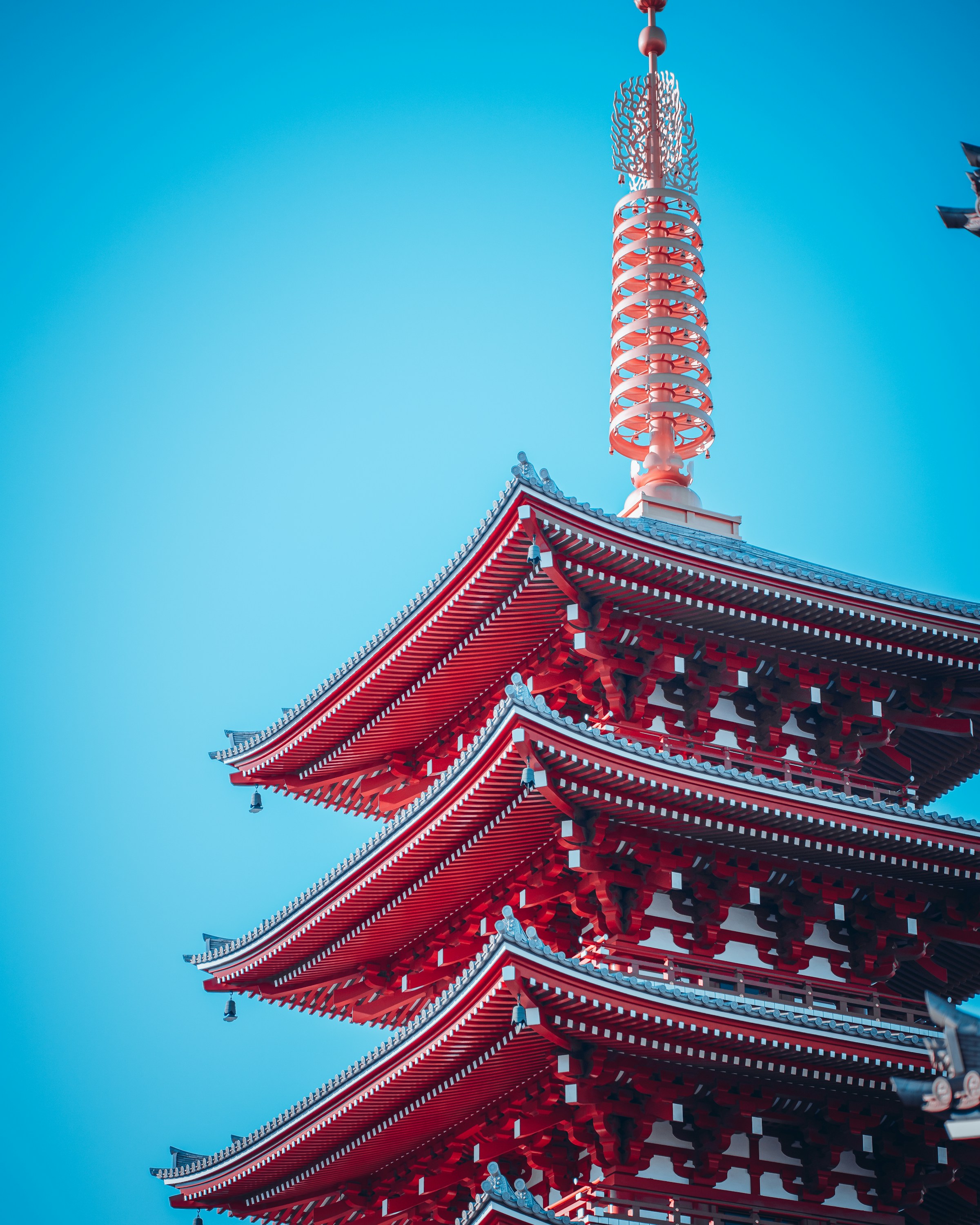 Red Japanese Sensoji Temple with clear blue sky.