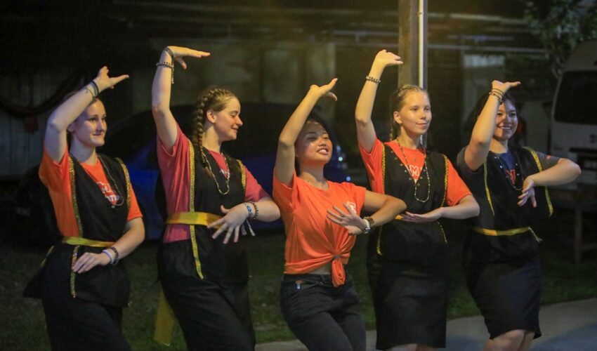 Travellers learning to dancing in Borneo.