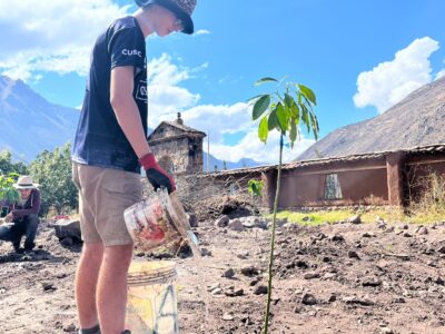 Student Planting at Camp Tarawasi on a Camps Expedition