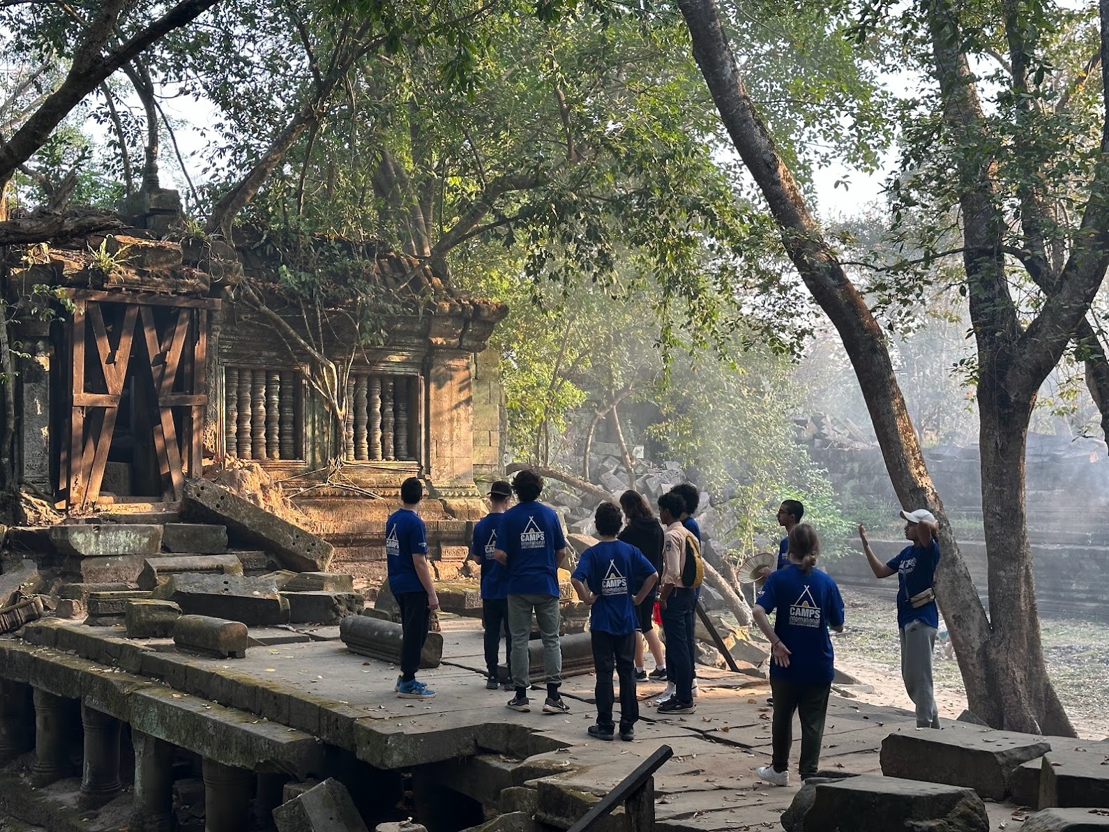Group of travellers exploring a temple in Cambodia