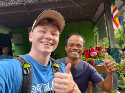Traveller and camp crew in Cambodia