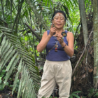 Carmelina standing in the jungle