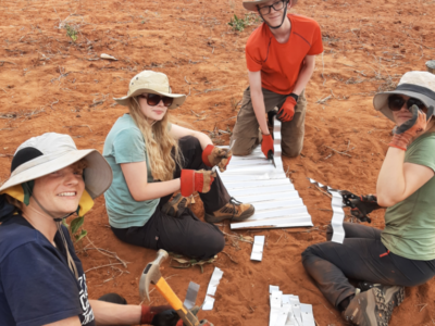 Group of students on a Camps International expedition to Kenya working on making some elephant deterrent fences for the local communities