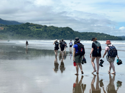 Students walking along a beach in Costa Rica