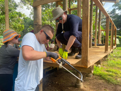 students working on a wooden structure in Costa Rica