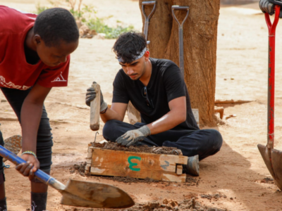 Group of students on a Camps International expedition working on service-led projects alongside the local community in Kenya, learning lessons beyond the classroom.