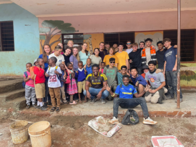 Group of students on a Camps International expedition working on service-led projects alongside the local community in Tanzania, learning lessons beyond the classroom.