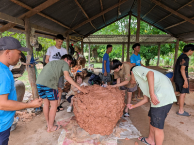 Group of students on a Camps International expedition working on service-led projects alongside the local community in Cambodia, learning lessons beyond the classroom.