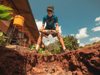 student traveller in Tanzania wearing a mask and doing project work in Tanzania