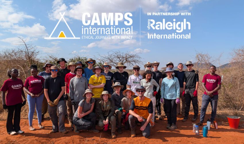 group photo of traveller students in Camp Tsavo, Kenya with Camps International and Raleigh logo on it